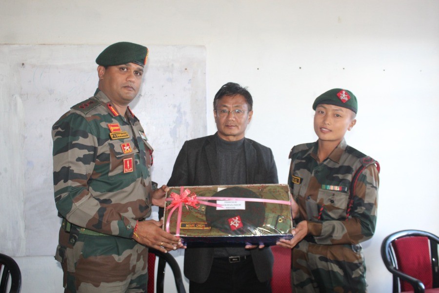 Nonie Chizo (extreme right) being felicitates by Col PS Chundawat (extreme left) with Token along with PGC Principal Dr T Tiakaba Jamir (middle) during the felicitation ceremony at PGC on November 20.